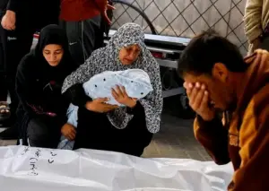 Palestinian woman holding dead child