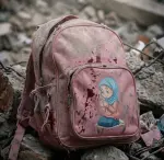 Blood-stained schoolbag in Iran